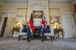 上任后首访英国，德国总理与英首相会晤